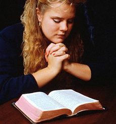 A WOMAN PRAYING